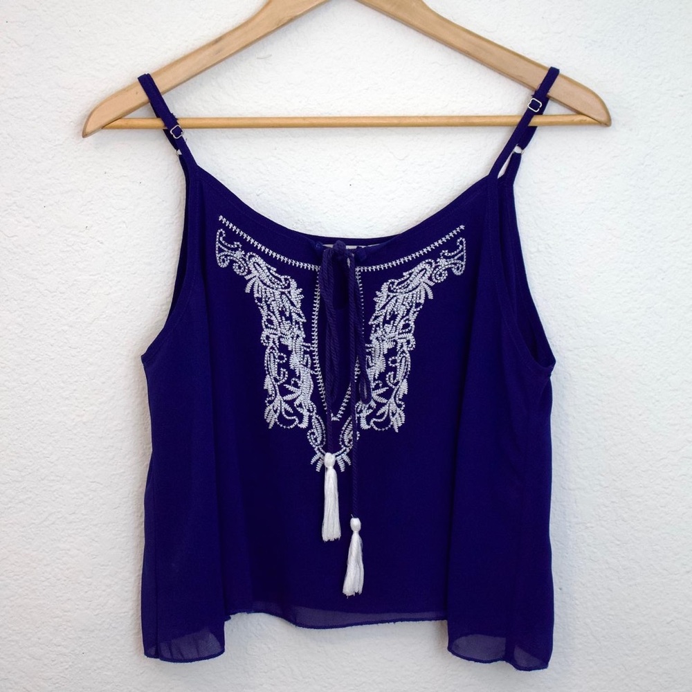 Blue flowy top with white embroidery
